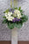 pureseed sy172 + gerberas, ping pong, brassica, eustomas, tuberose, sympathy stand