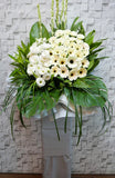 pureseed sy110 + Gerberas and Eustomas, tuberoses + sympathy stand