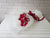 pure seed bq423 red roses & sweet williams hand bouquet in white wrappers