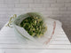 pure seed bq614 chamomile flowers hand bouquet with pastel green wrappers