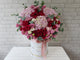 pure seed bk876 pink & red hued hydrangeas + roses + eustomas + eucalyptus leaves floral centrepiece
