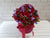 pure seed bk798 red roses + berries + statice flower basket
