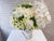 pure seed bk890 white roses + white hydrangeas + white eustomas + white orchids flower arrangement