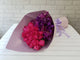 pure seed bq561 hot pink roses & purple mokara orchids hand bouquet in purple wrappers