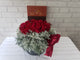 pure seed bk630 red roses & eucalyptus leaves table flower arrangement with royce chocolate