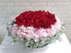 pure seed bk585 60 red roses encircled in pastel pink hydrangeas & silver leaves floral arrangement