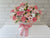 pure seed bk980 roses + carnations + eustomas + baby's breath floral centrepiece