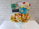 pure seed nb171 + Roses, Eustomas & Orchids with Romper and musical soft toy + new born arrangement