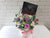 pure seed bk976 8 stalk roses with royce chocolate floral arrangement