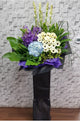 pureseed sy158+ hydrangeas, orchids, gerberas, tuberoses + sympathy stand
