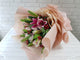 pure seed bq695 lilies + roses + euphorbias + red berries hand bouquet