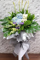 pureseed sy180 + Gerberas, Orchids, Eustomas, Fox Tail and Tuberose + sympathy stand