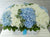 pure seed bk484 white roses & pastel blue hydrangeas flower basket