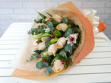 pure seed bq228 pink lilies & champagne roses flower bouquet in light orange wrapper