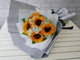 pure seed bq499 sunflowers & baby's breath hand bouquet in grey wrappers
