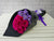 pure seed bq531 hot pink gerberas & purple statice flowers hand bouquet in black wrapper