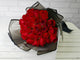 pure seed bq452 red roses hand bouquet in black & white wrappers