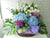 pure seed fr078 + eustomas, hydrangeas, roses, matthiolas and fresh fruit basket